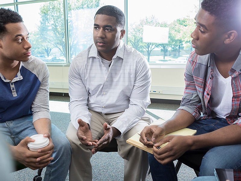 Group of black men in group meeting